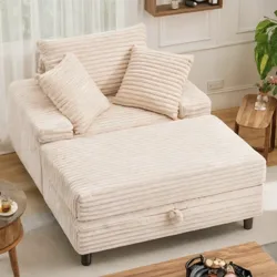 A beige, ribbed fabric sofa with large and small cushions is paired with a matching ottoman in a cozy living room, featuring minimalist decor with a small round wooden table and a plant.