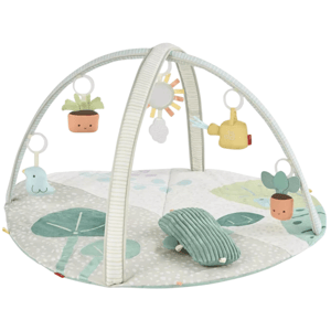 A baby play gym featuring a soft, padded mat with a botanical theme, arches with hanging toys including a bird, sun, cloud, and potted plants, designed for infants to engage and play.