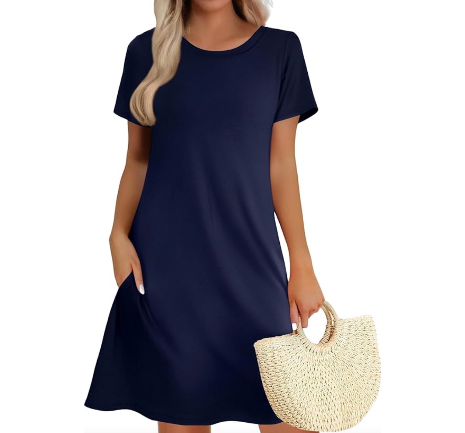 A short-sleeve navy T-shirt dress with a simple round neckline and side pockets, paired with a woven straw handbag.