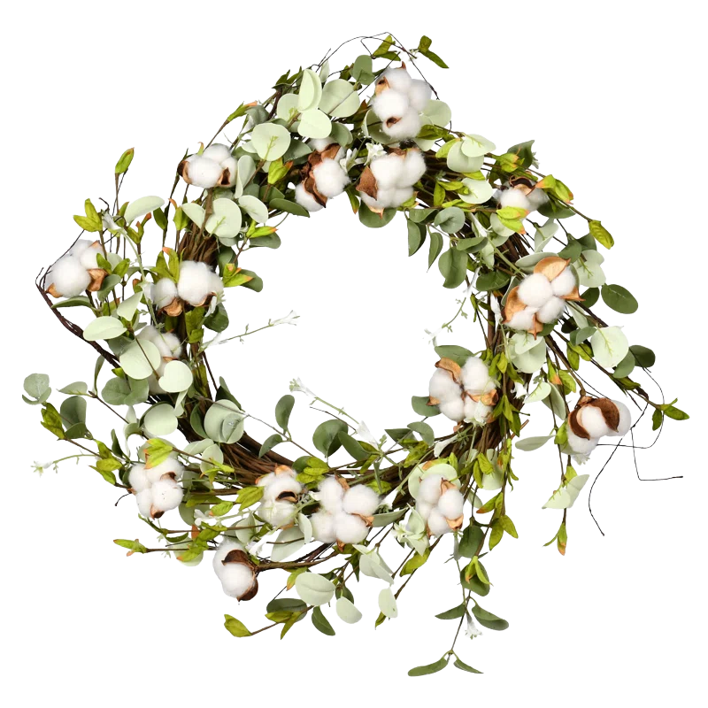 A decorative wreath featuring green leaves, twig branches, and cotton bolls.