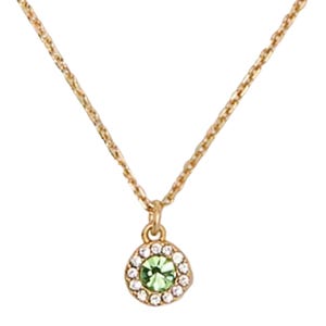 A gold chain necklace with a circular pendant featuring a central green gemstone, surrounded by white stones.