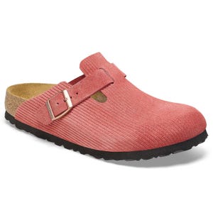 Pink suede clog-style shoe with a ribbed texture, an adjustable buckle strap, and cork footbed.