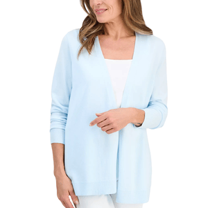 A woman is wearing a light blue open-front cardigan over a white top. The cardigan features long sleeves and ribbed cuffs.