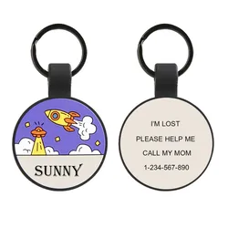 A round keychain with a colorful rocket design and the word \“SUNNY\“ on one side; the other side states, \“I'M LOST, PLEASE HELP ME, CALL MY MOM\“ with a contact number.