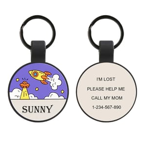 A round keychain with a colorful rocket design and the word \“SUNNY\“ on one side; the other side states, \“I'M LOST, PLEASE HELP ME, CALL MY MOM\“ with a contact number.