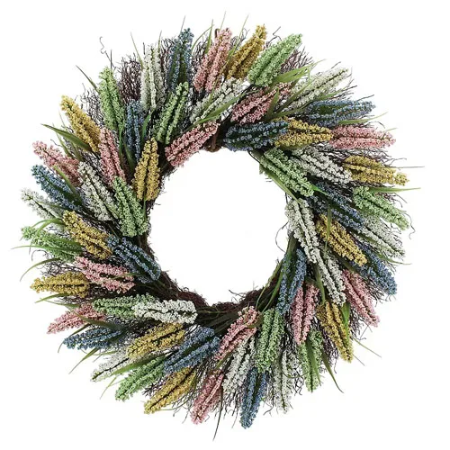 A decorative wreath with colorful artificial flowers in shades of pink, yellow, blue, green, and white, arranged in a circular pattern.