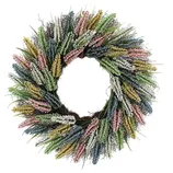 A decorative wreath with colorful artificial flowers in shades of pink, yellow, blue, green, and white, arranged in a circular pattern.