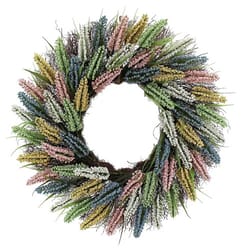 A decorative wreath with colorful artificial flowers in shades of pink, yellow, blue, green, and white, arranged in a circular pattern.