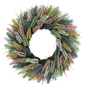 A decorative wreath with colorful artificial flowers in shades of pink, yellow, blue, green, and white, arranged in a circular pattern.