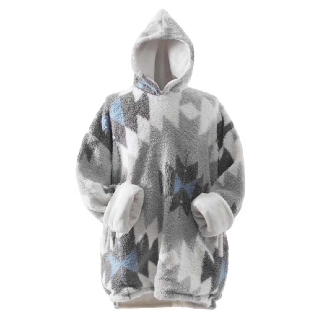 A hooded sweatshirt blanket with a geometric pattern in grey, white, and blue. Made from plush, fuzzy material for warmth and comfort.