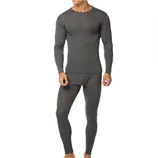 A man is wearing a dark gray long-sleeve thermal underwear set, consisting of a fitted top and matching leggings, ideal for cold weather layering.