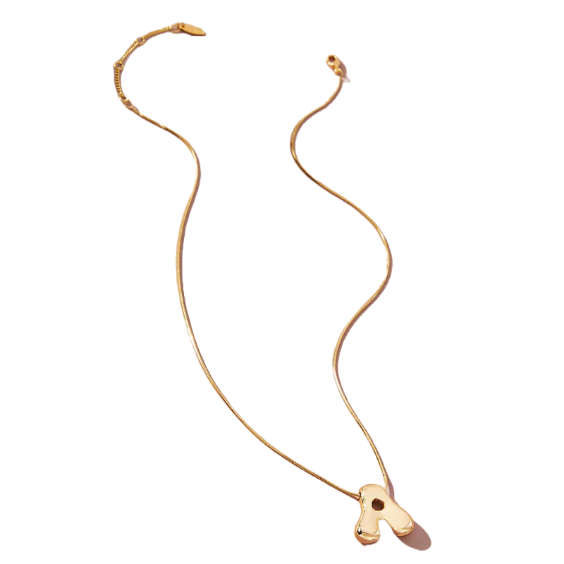 Gold-tone necklace featuring a bubble letter pendant shaped like \“A,\“ with a smooth snake chain and an adjustable clasp closure for length customization.