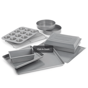 Baking set with a muffin tin, loaf pan, round cake pans, baking sheets, cooling rack, and a covered rectangular pan.