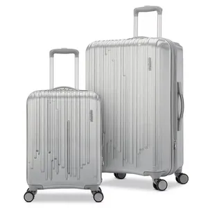 Two silver suitcases with vertical line designs, featuring telescopic handles and four-wheel spinners.