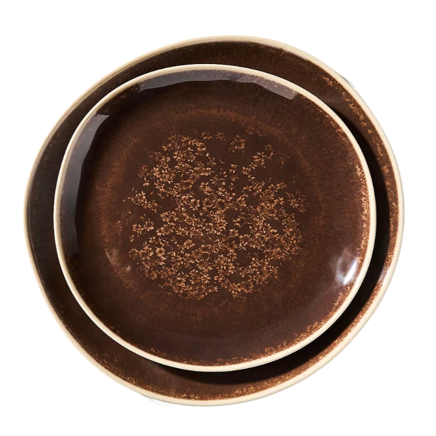 Two brown ceramic plates with a textured pattern and slightly curved edges, one smaller plate nested inside a larger one.