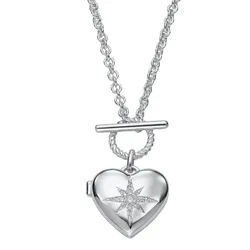 A silver heart locket necklace features a star design embellished with small crystals and includes a T-bar clasp on a chain.