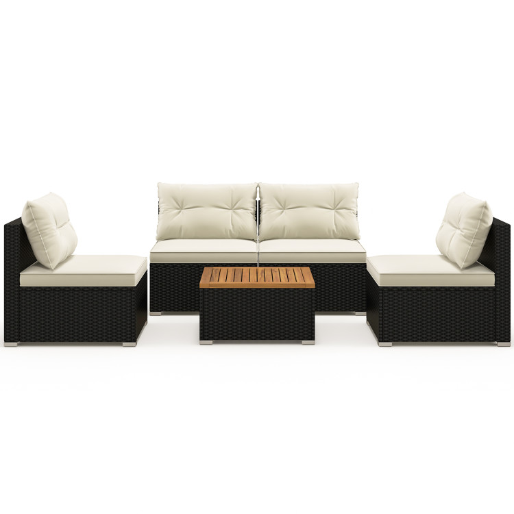A modern outdoor sectional sofa set with beige cushions, featuring a black wicker base and a central wooden coffee table.