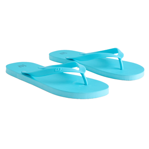 A pair of turquoise flip flops with a simple design featuring the Gap logo on the straps. They have flat soles and a classic thong style.