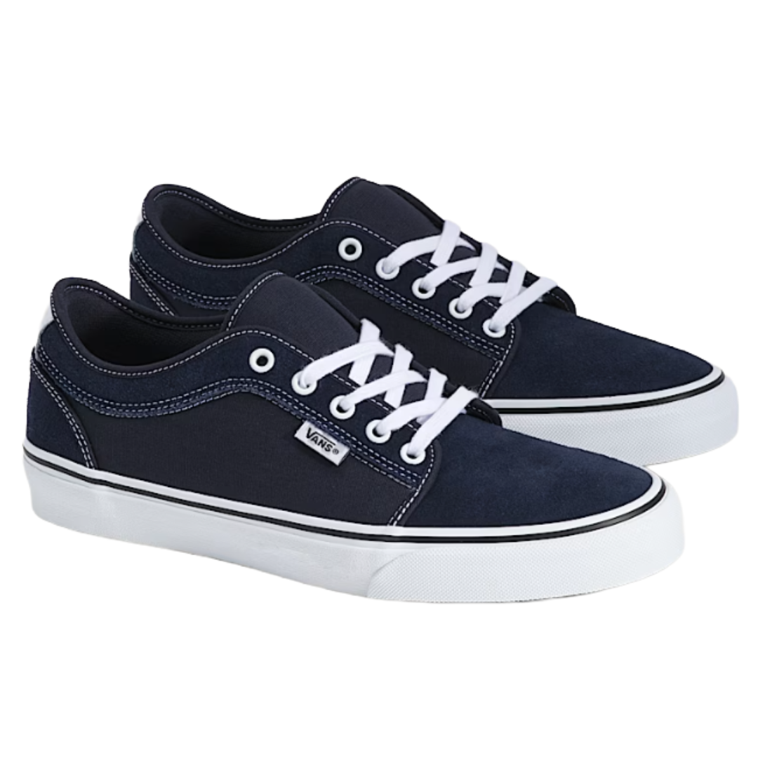 Navy blue Vans sneakers with white laces and stitching, featuring a low-top design and white rubber soles.