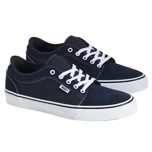 Navy blue Vans sneakers with white laces and stitching, featuring a low-top design and white rubber soles.