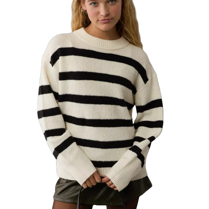 A striped crew neck sweater with alternating black and white horizontal bands, featuring a ribbed texture on the hem, cuffs, and neckline.
