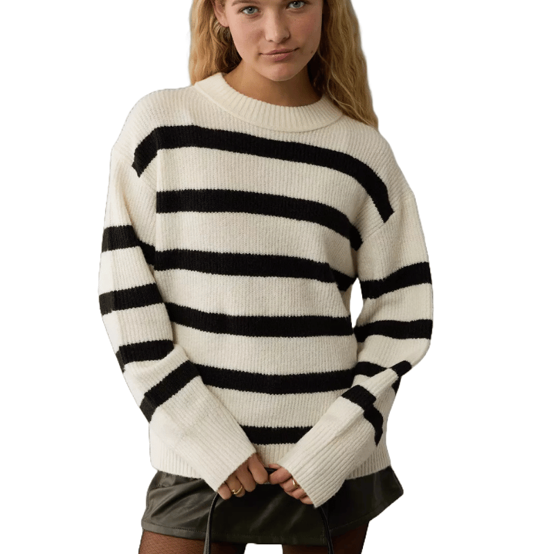 A striped crew neck sweater with alternating black and white horizontal bands, featuring a ribbed texture on the hem, cuffs, and neckline.