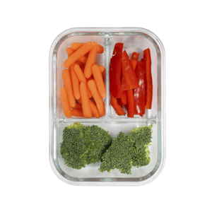 A glass container with three compartments holds baby carrots, sliced red bell peppers, and broccoli florets.
