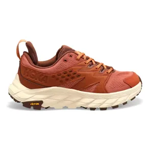 Hoka hiking shoe in terracotta color with a Vibram sole, featuring breathable mesh and synthetic overlays for durability.