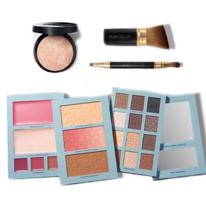 Variety of makeup products including a face powder, Laura Geller brush, double-ended eye brush, and palettes for creams, blush, setting powder, and eyeshadow, with shades ranging from pink to neutral tones.