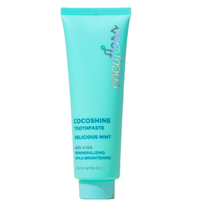 Cocoshine toothpaste in a turquoise tube features a delicious mint flavor, focusing on remineralizing and smile-brightening benefits with n-HA.