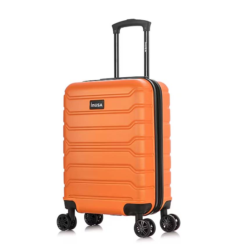 Orange suitcase with a textured hard shell, featuring a black telescopic handle and four rotating wheels for easy maneuverability.