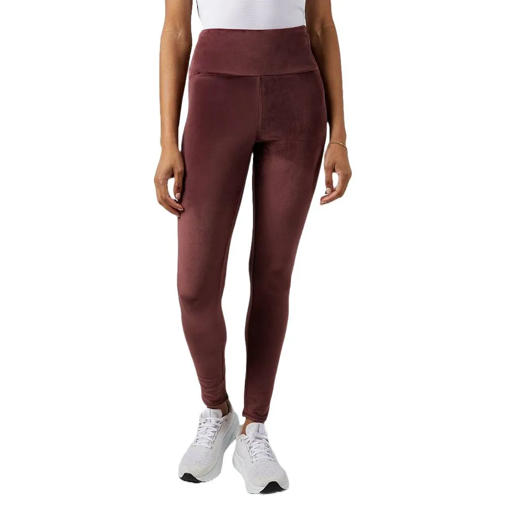 High-waisted, brown leggings paired with white sneakers and a white top.