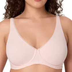 A woman is wearing a light pink, underwire bra with a smooth, seamless design and wide shoulder straps.