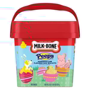 Milk-Bone Peeps Easter Dog Treats are marshmallow-flavored dog biscuits in a 22 oz red container. The packaging features colorful Easter-themed illustrations, including bunnies and decorated eggs, highlighting its limited edition status.