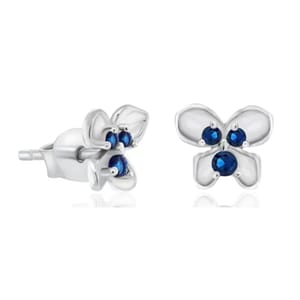 Stud earrings in a floral design, featuring blue gemstones set in a silver or white gold setting.