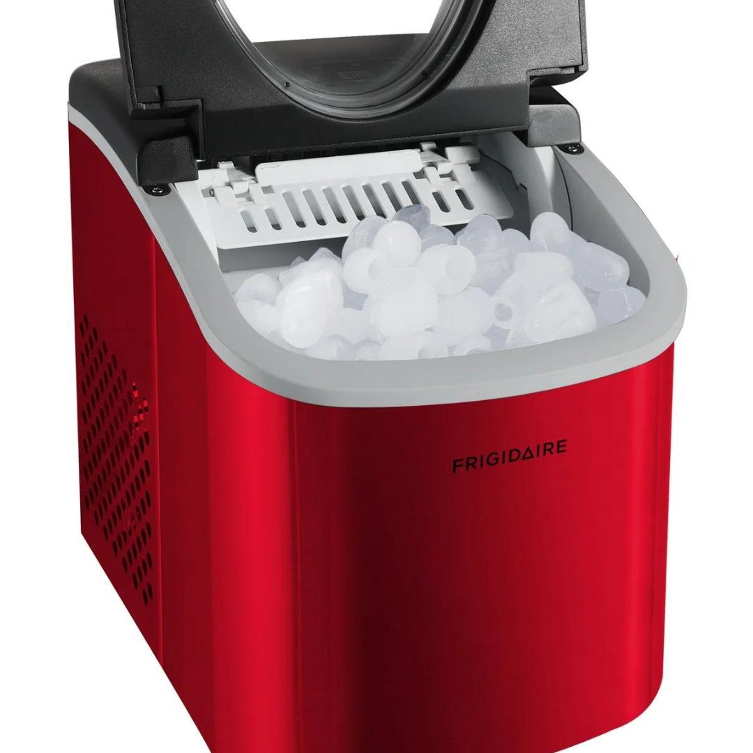 A red portable ice maker filled with bullet-shaped ice cubes.
