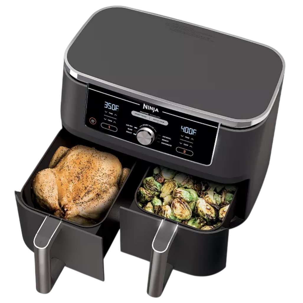 A Ninja dual-zone air fryer with two compartments is shown, cooking a whole seasoned chicken and roasted Brussels sprouts, with separate temperature settings for each drawer.