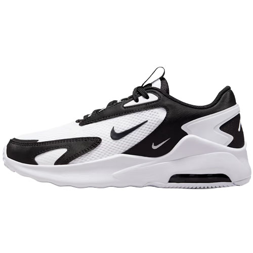 A black and white athletic sneaker with a prominent swoosh logo on the side, featuring a mesh and synthetic layered design with a thick cushioned sole.