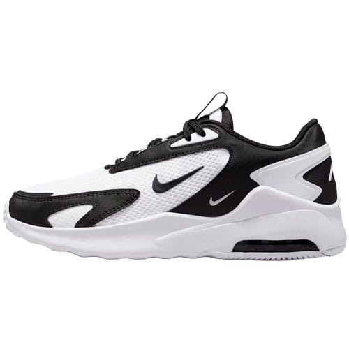 A black and white athletic sneaker with a prominent swoosh logo on the side, featuring a mesh and synthetic layered design with a thick cushioned sole.