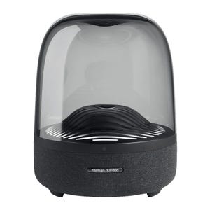 This is the Harman Kardon Aura Studio 3 speaker featuring a dome-like, transparent top with a wave-inspired design inside and a black fabric-covered base.