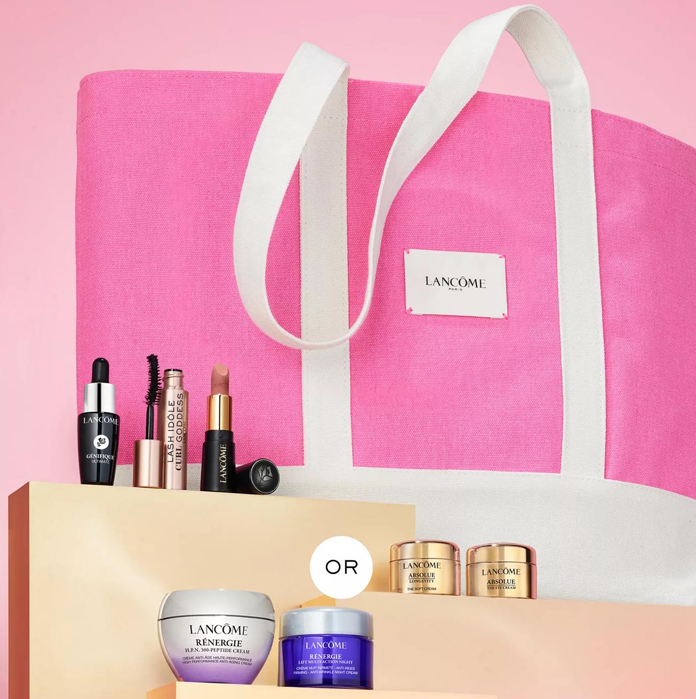 Lancôme set with skincare and makeup items includes Génifique serum, mascara, lipstick, Rénergie Lift Multi-Action cream, Absolue Soft cream, and night cream, all displayed with a pink tote bag.