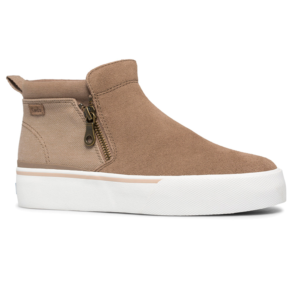 A tan suede high-top sneaker with zipper detailing and a thick white sole.