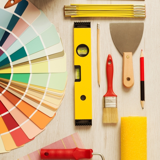 Paint swatches, a level, meter ruler, paintbrush, pencil, paint scraper, and roller.
