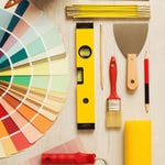 Paint swatches, a level, meter ruler, paintbrush, pencil, paint scraper, and roller.