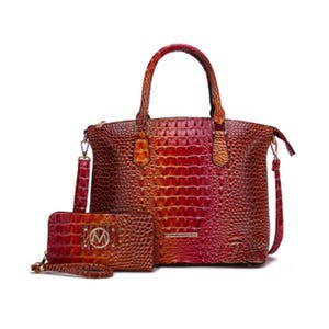The MKF set includes a 14\“ tote and a wallet, both in a crocodile-embossed pattern. The tote has a structured design with dual handles and a detachable shoulder strap, and the wallet matches in color and texture with a wrist strap and metallic emblem.
