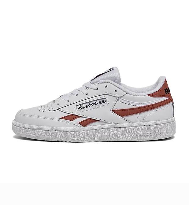 Reebok Club C Leather Shoes feature a classic white leather design with brown accents, a low-cut silhouette, and Reebok branding on the side and heel. They have a textured rubber sole for grip and a lace-up closure for a secure fit.