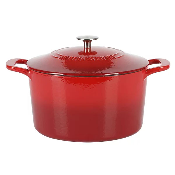 Red enameled cast iron Dutch oven with a lid and side handles.