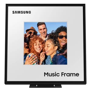 Samsung Music Frame is a digital display that combines art and audio, featuring a frame design showcasing a photo of people enjoying music. It's designed to blend into home decor, functioning as both a speaker and a visual display.