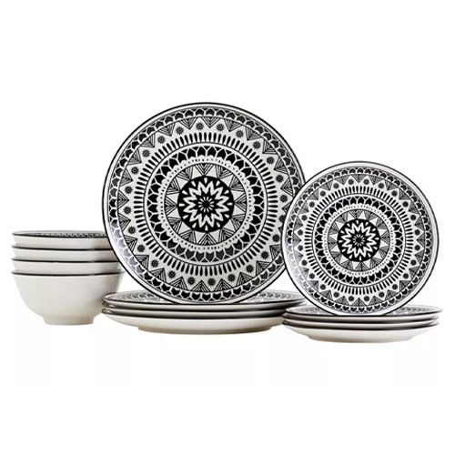 Black and white dinnerware set featuring plates and bowls with intricate mandala designs.