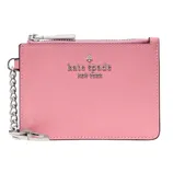 A pink Kate Spade New York coin pouch with a silver zipper and keychain. The brand logo is embossed on the front.